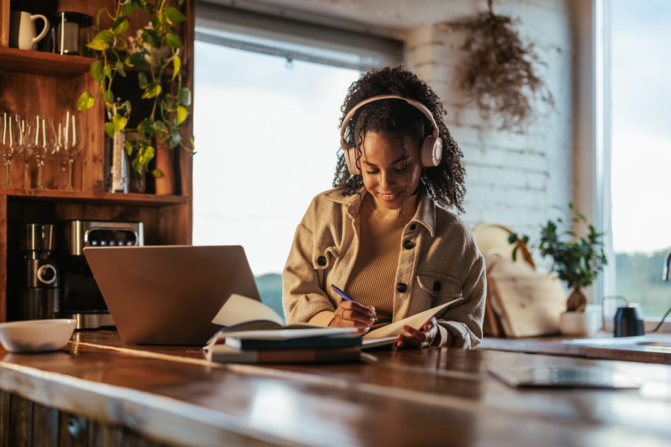 Remote employee working on a laptop from a home office