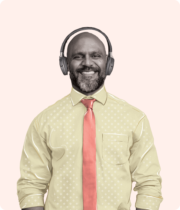Smiling man with headphones and a chat notification to the side.