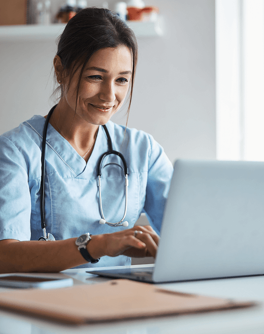 Healthcare professional using laptop