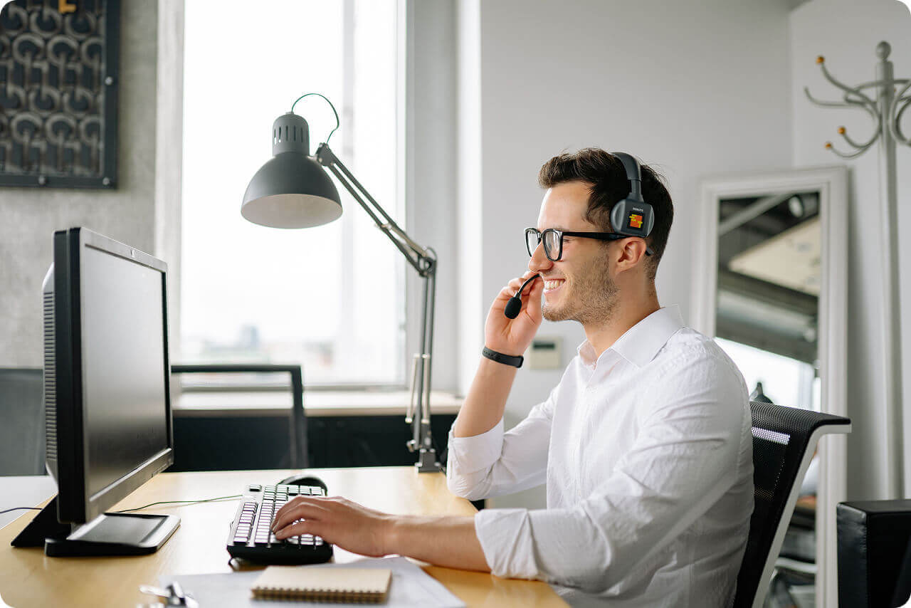 Technician providing remote desktop support from a workstation