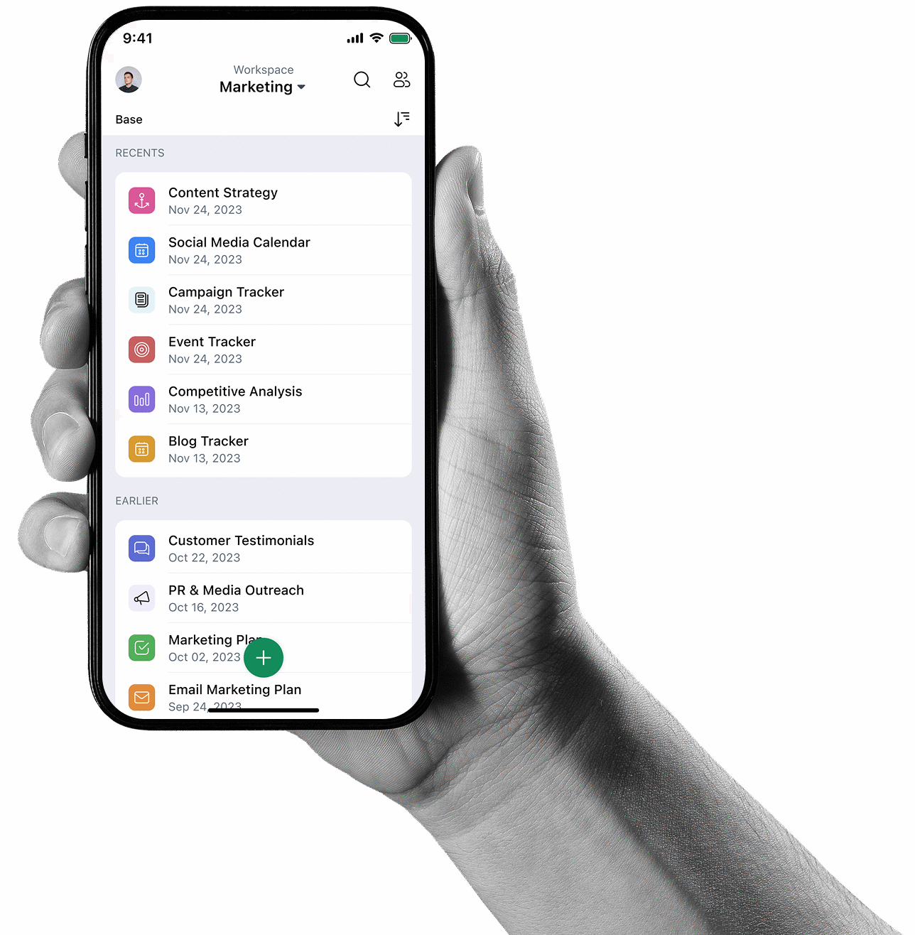 A hand holding a phone running the Zoho Tables app