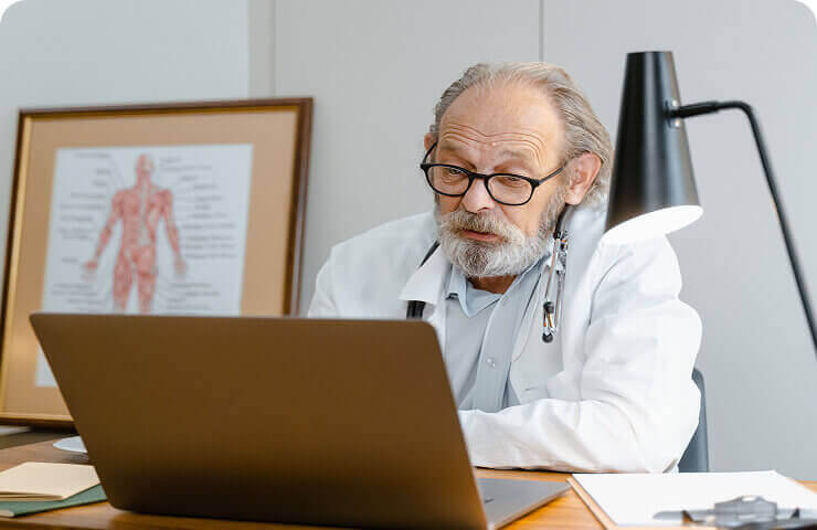 Healthcare professional using a computer
