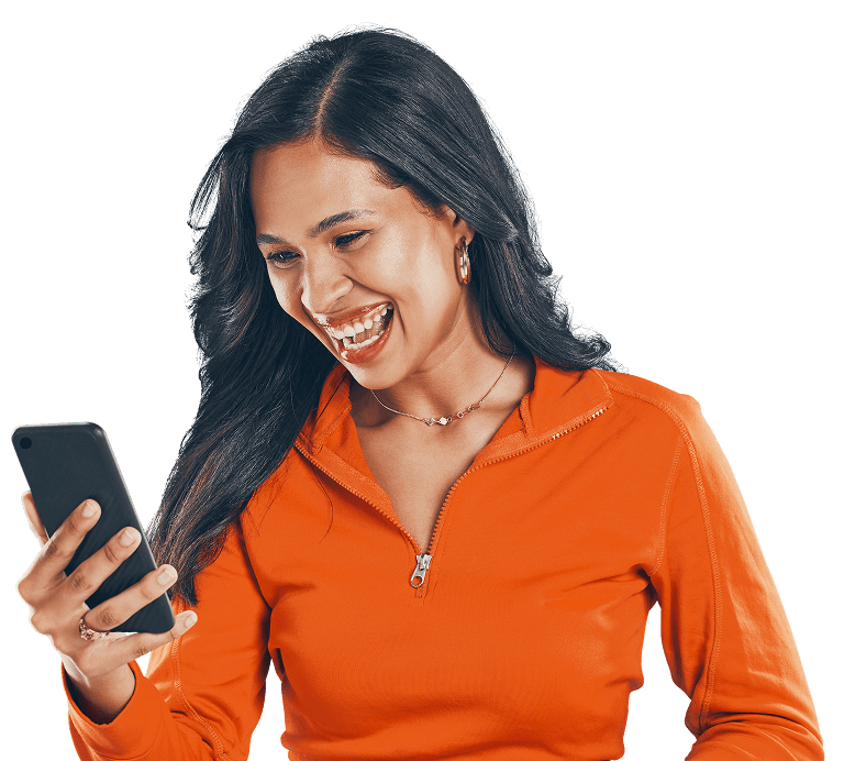 Woman smiling while checking loyalty rewards on her phone